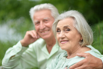Portrait of beautiful senior couple posing in the park