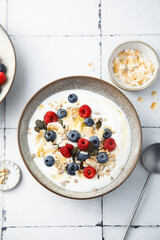 Granola with yogurt, fresh berries and coconut
