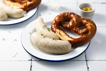 White sausages with salted pretzel