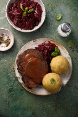 Roasted meat with red cabbage and potato dumplings