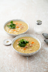 Homemade pea soup with smoked meat