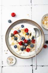 Granola with yogurt, fresh berries and coconut