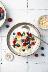 Granola with yogurt, fresh berries and coconut