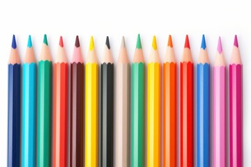 Fototapeta premium Colored pencils laying in row backgrounds order white background.