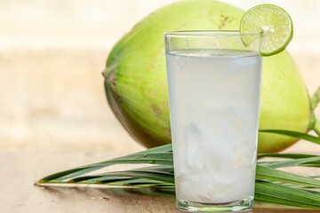 Natural Coconut Drink and Fruit Arrangement on Wood Surface