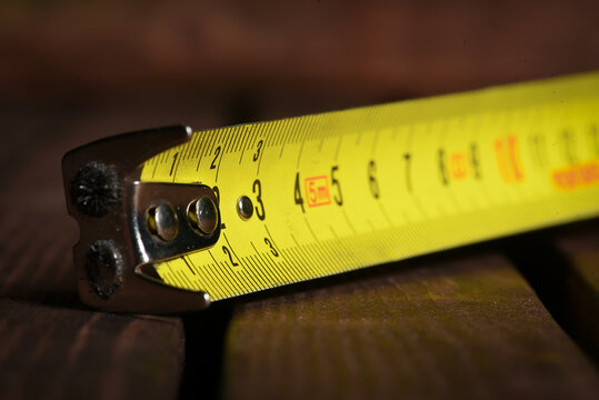Construction measuring tape close up background.