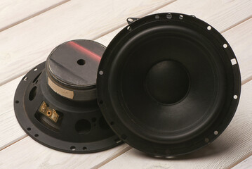 Modern car audio stereo speakers on the workbench background. Car stereo renew concept. Top view.