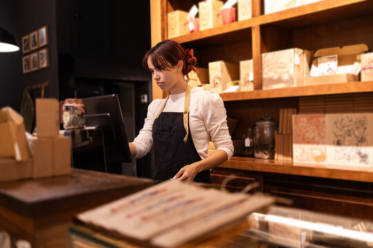 Boutique chocolate shop employee at work