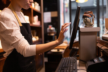 Woman managing chocolate store