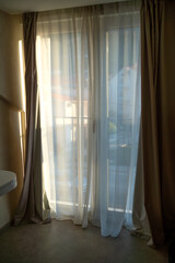 Morning sunlight enters the room through the curtain 