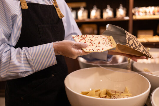 Artisan chocolate shop selecting gourmet delights