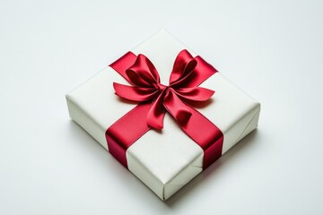 Obraz premium Festive Gift Box: Red Ribbon on Elegant White Box for Christmas, Birthday, and Anniversary Celebrations