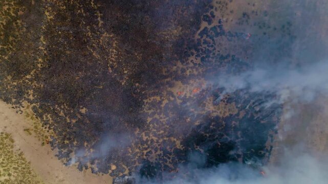 Burning Grass in Large Field