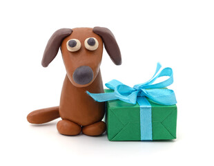 Plasticine puppy and green gift.