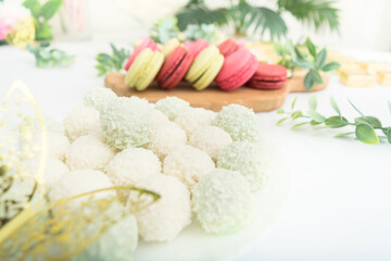Group of green and red sweet macaroons. Closeup view