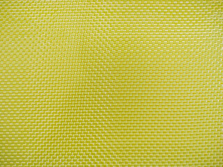 Bulletproof material aramid. Yellow kevlar texture and pattern.