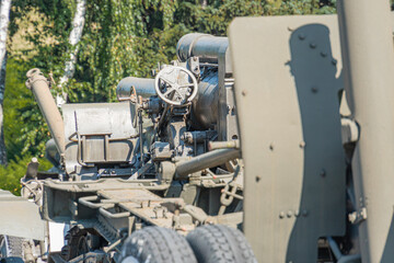 Supplies of weapons for Ukraine. Ukrainian artillery, detail of weapons Russian-Ukrainian war. Part of the weapon in close up. Military khaki coloring. Metal gun metal. New guns artillery