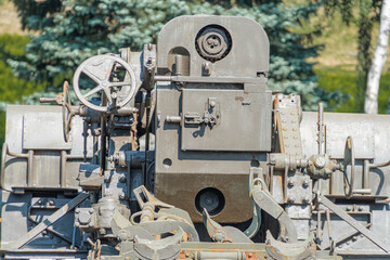 Supplies of weapons for Ukraine. Ukrainian artillery, detail of weapons Russian-Ukrainian war. Part of the weapon in close up. Military khaki coloring. Metal gun metal. New guns artillery