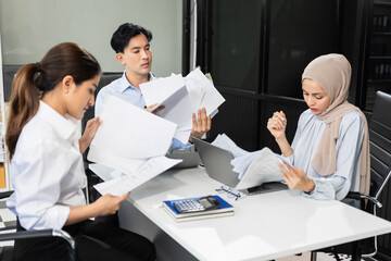 Fototapeta premium Businessman team working are under stress from financial data and report graph. Failed teamwork concept