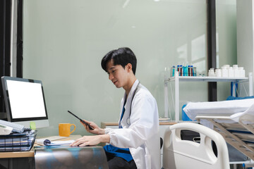 Medical Technology Concepts. The doctor is working on a tablet digital tablet computer in office  in the morning at the desk.