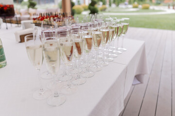 glasses with champagne on the table in the restaurant at the holiday