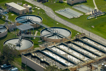 Aerial view of modern water cleaning facility at urban wastewater treatment plant. Purification...