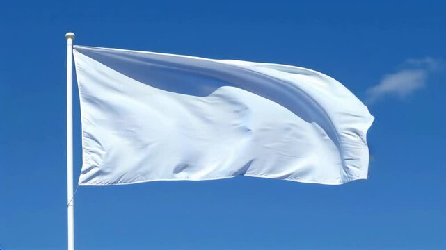 Plain white flag waves gently against a clear blue sky, symbolizing peace and surrender. The flag&rsquo;s folds catch the light, creating subtle shadows, and moving gracefully in the breeze.