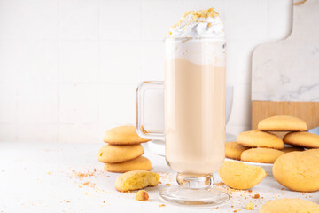 Shortbread sugar cookies milkshake, creamy shake drink with whipped cream and biscuits crumbs