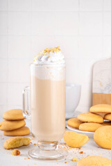 Shortbread sugar cookies milkshake, creamy shake drink with whipped cream and biscuits crumbs