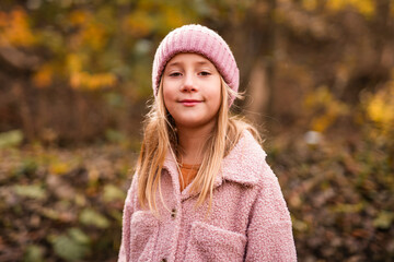 Child girl having fun on Autumn Forest