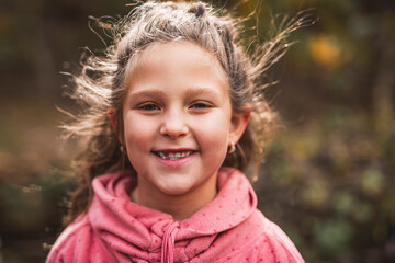 Child girl having fun on Autumn Forest