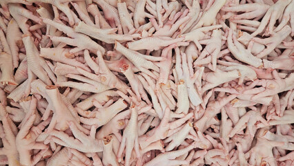 fresh chickens feet on butcher shop. © alphaonetwo