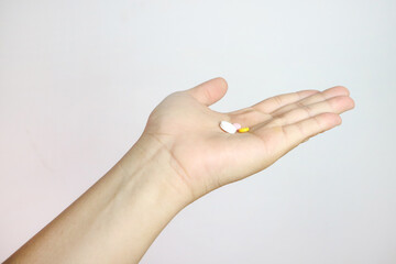 Handful of pills on a white background