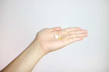 Handful of pills on a white background