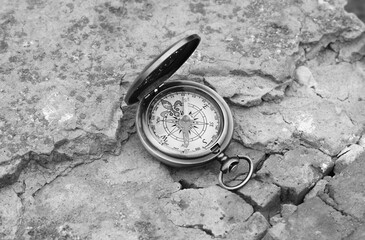 Classic navigation compass on natural background