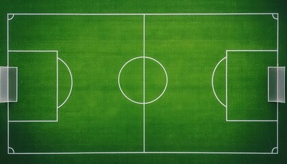 Fototapeta premium Aerial view of a green soccer field with white lines, empty except for a few players training in the distance, captured from directly overhead by a drone
