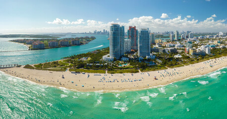 Popular vacation spot in the United States. Ocean warm waters and sandy beachfront at Miami Beach...