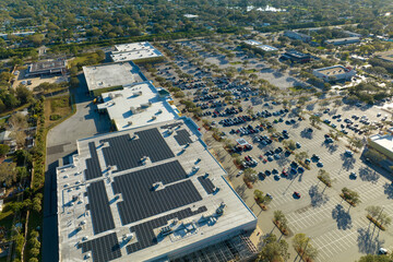 Producing of sustainable energy. Electric photovoltaic solar panels installed on shopping mall...
