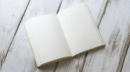 Fototapeta premium Exploring Creativity with a Blank Open Notebook on a Wooden Table