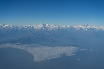 A breathtaking view of the snow-capped mountain range under a clear blue sky.