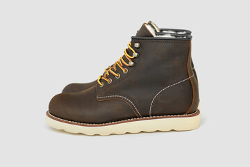 Brown leather boots on white background. Fashion 