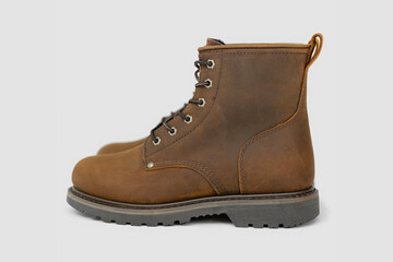 Brown leather boots on white background. Fashion 