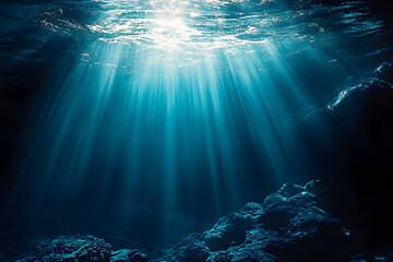 Naklejka premium Sunlit Depths: A Mesmerizing Glimpse of the Deep Blue Ocean, World Oceans Day