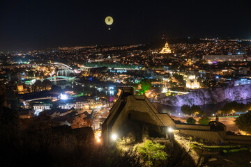 Fototapeta premium Panoramic view of Tbilisi city from Narikala fortress after the sunset