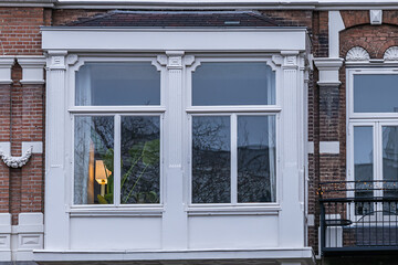 Villa (1884), consisting of three residential buildings in the Flemish Renaissance style with two corner towers and bay windows on Weteringschans 10 - 14. Amsterdam, The Netherland. 
