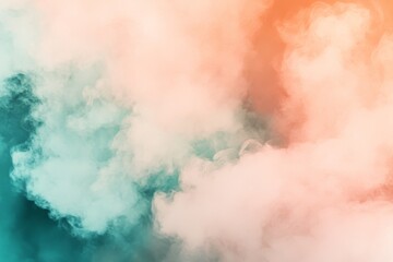 Obraz premium A mesmerizing blend of colorful mist, swirling in soft pastel hues of orange and teal. This abstract composition evokes a sense of tranquility and dreaminess.