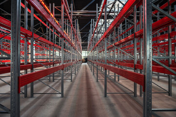 Logistics warehouse concept with empty high pallet racks, shelving system