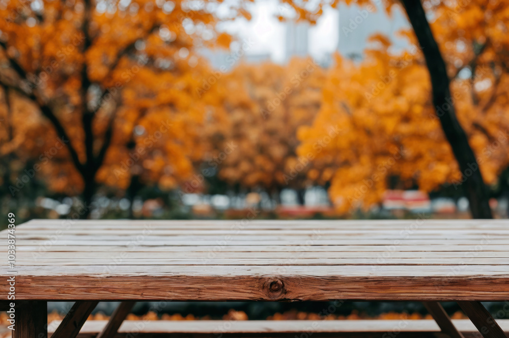 Aufkleber Empty wooden table showing autumn background with blurry trees