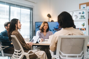 Business asian woman sitting in office meeting presentation ESG and technology innovations recycle material for sustainable product