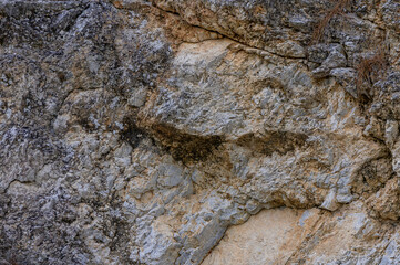 Unique rock formation resembling a face in nature at a remote location during daylight